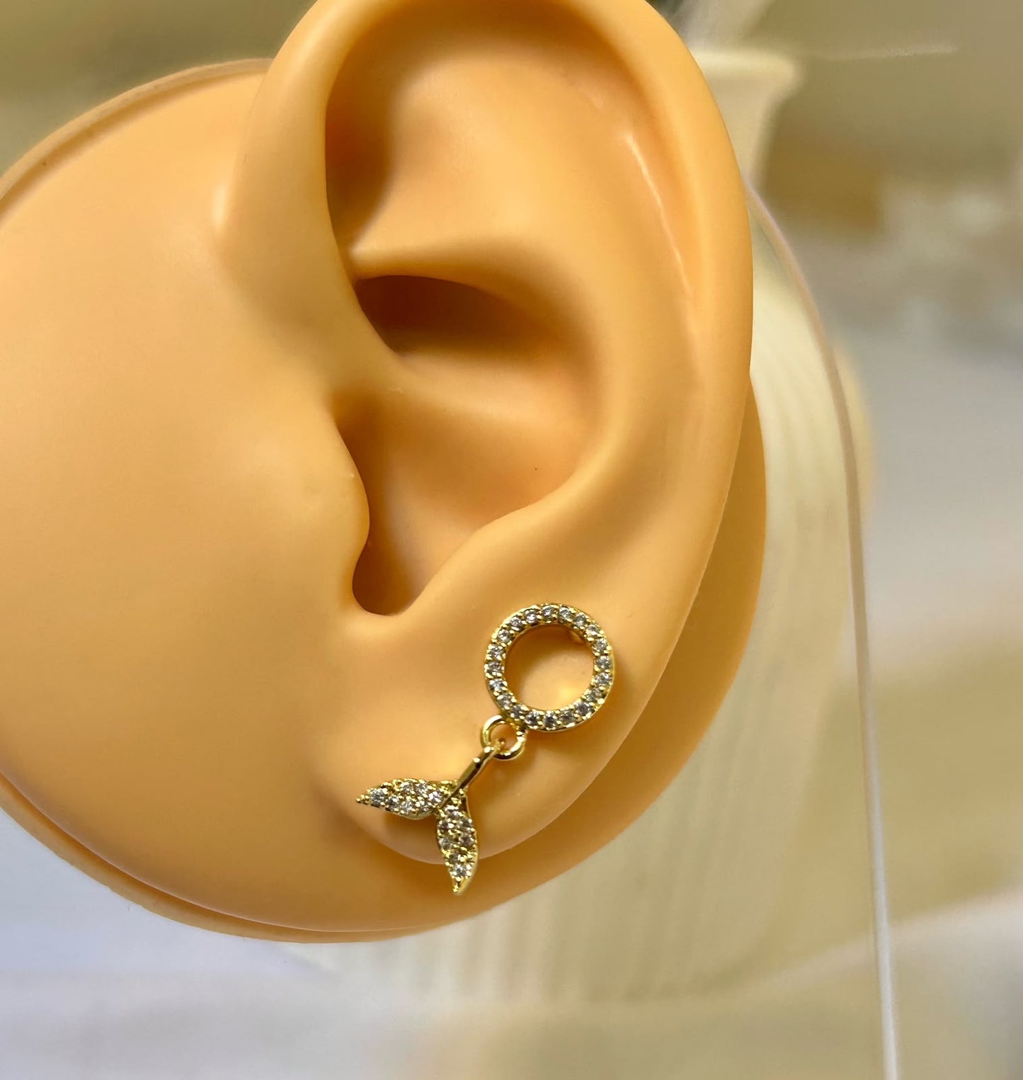 Dangling Mermaid Tail Piercing