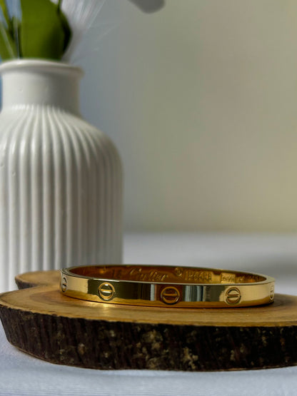 Iconic Screw Accent Gold Bangle